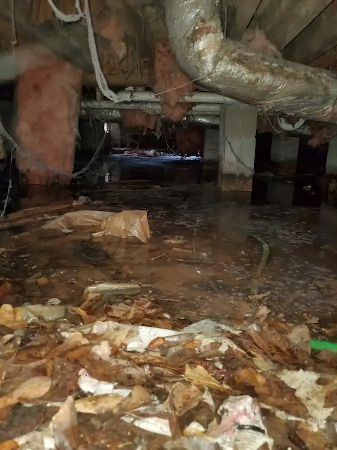 Crawl space flood assessment for Commercial Water Damage Restoration in East Manchester